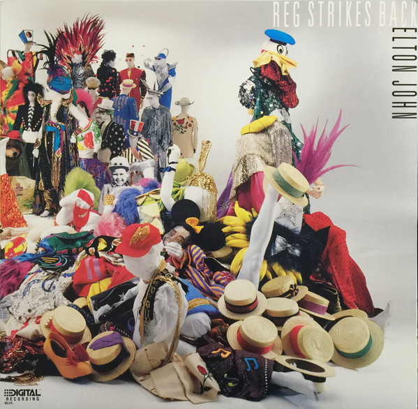Elton John ‎– Reg Strikes Back